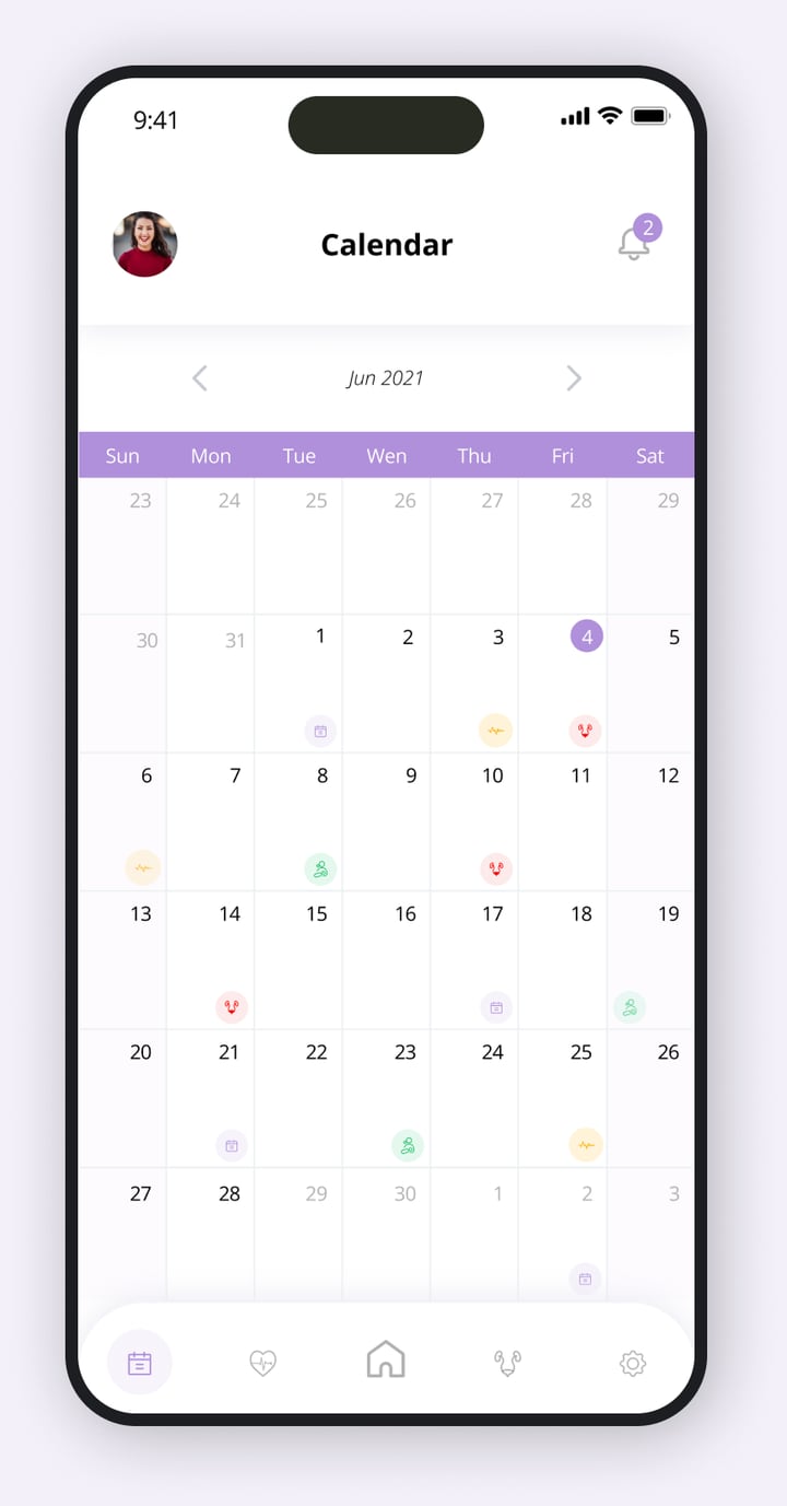 FemTek calendar screen showing a month view with colour coded cycle event icons